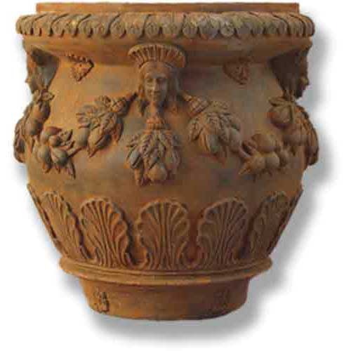 Ornate old world European planter with classical faces, fruit garlands, and shell motifs in a Baroque and Renaissance style.