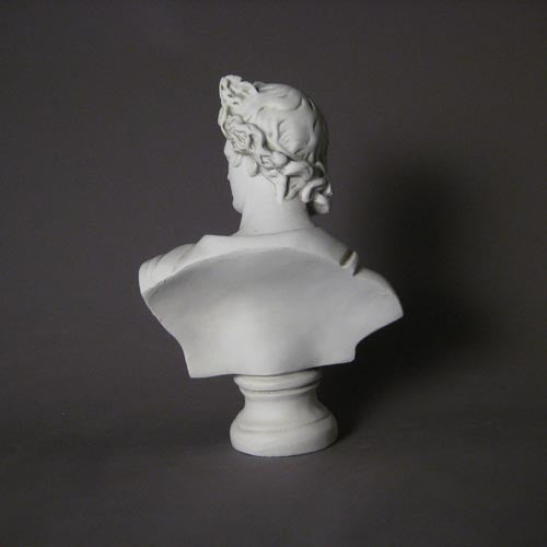 Classical Greek-style bust with ornate drapery and detailed hair, featuring a serene, idealized facial expression. Side Angle