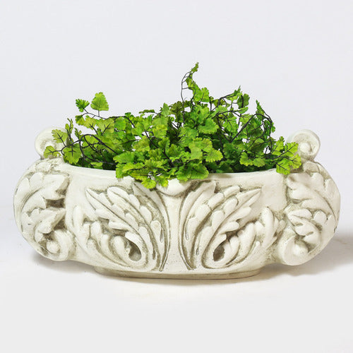 Ornate round bowl with classical old world European scrollwork and leaf motifs, featuring Baroque-inspired decorative handles. Side Angle