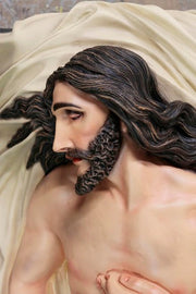 Reclining figure of Christ with classical Renaissance detailing, draped in cloth, featuring ornate, old world European styling. Different Angle