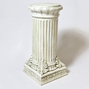 Classical bust of a man on an ornate fluted pedestal with acanthus leaf detailing, inspired by old world European sculpture. Side Angle