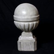 Ornate old world European finials with classical rounded tops and fluted bases, displayed in three graduated sizes on square pedestals. Different Angle