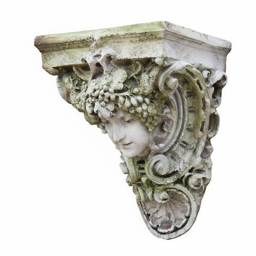 Ornate old world European wall corbel with classical female face, intricate scrollwork, and Baroque decorative detailing.