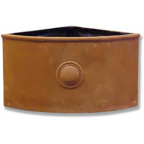 Corner planter with classical old world European design, featuring an ornate central medallion and curved front panel.