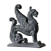 Griffin statue with ornate wings and classical detailing in an old world European, medieval style on a rectangular base.