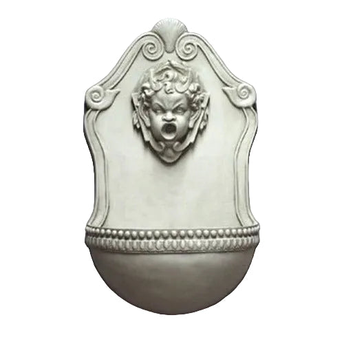 Wall fountain with ornate Baroque design, featuring a classical cherub face and decorative scrollwork in old world European style.