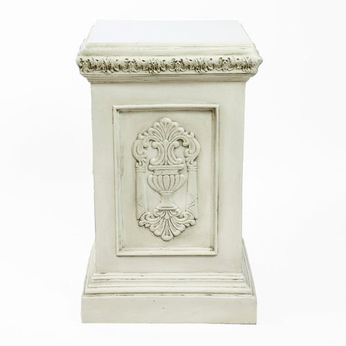 Classical European statue of a robed woman on an ornate pedestal with Renaissance and Baroque decorative reliefs. Other Angle