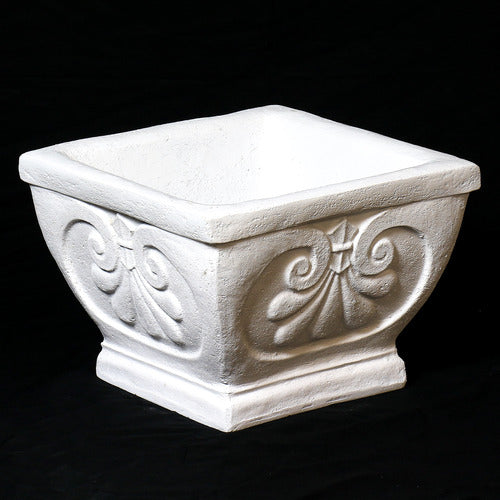 Square planter with ornate Baroque scrollwork and classical old world European detailing on a pedestal base. Side Angle