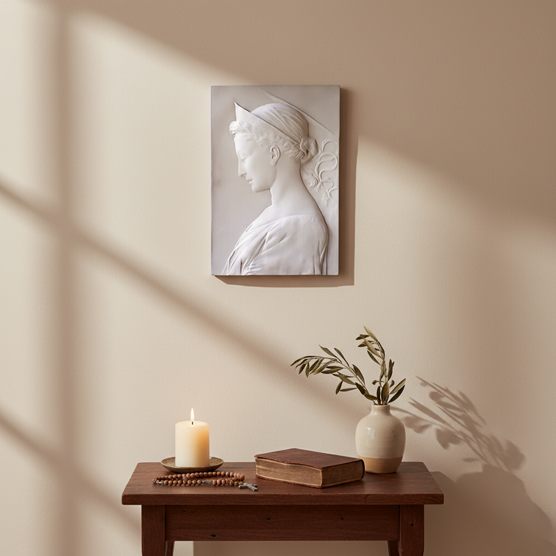 Classical Renaissance-style bas-relief of a woman in profile with delicate features, draped garment, and ornate headpiece. Side Angle