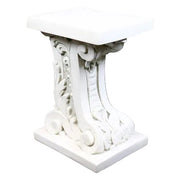 Ornate pedestal table with classical Baroque scrollwork and intricate old world European detailing on a square base and top.