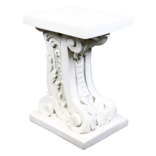 Ornate pedestal table with classical Baroque scrollwork and intricate old world European detailing on a square base and top.