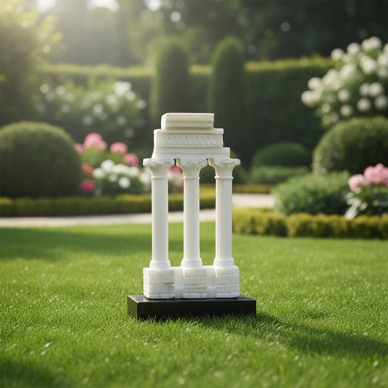 Classical Greek temple ruins with three ornate Corinthian columns and detailed entablature on a stepped base. Side Angle