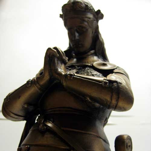 Kneeling medieval knight in ornate armor, hands clasped in prayer, classical old world European style with Gothic detailing. Additional Angle
