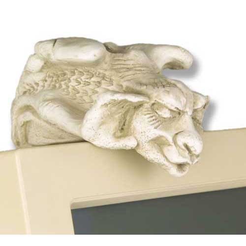 Gothic gargoyle figurine with ornate detailing perched atop a rectangular ledge, featuring a classical medieval expression.