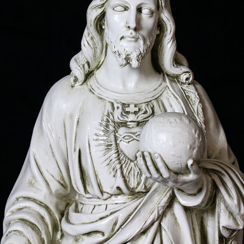 Jesus statue in classical Renaissance style, featuring ornate drapery and detailed facial features, holding a globe in one hand. Other Angle