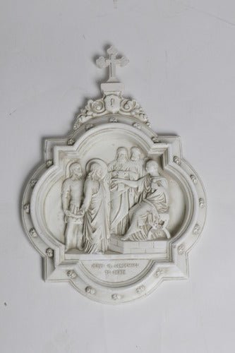 Baroque-style wall plaques depicting religious scenes in a Gothic church interior with vaulted ceilings and stained glass window. Different Angle